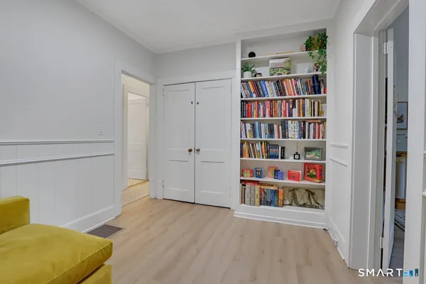 a view of a bedroom with shelves
