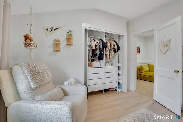 a living room with furniture and storage