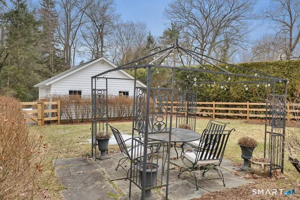a view of a chairs and table on the terrace
