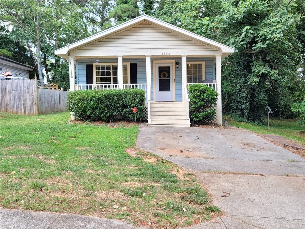 1508 Carter Road Decatur, GA 30032 - Photo 1 of 1 a view of a house with yard and plants