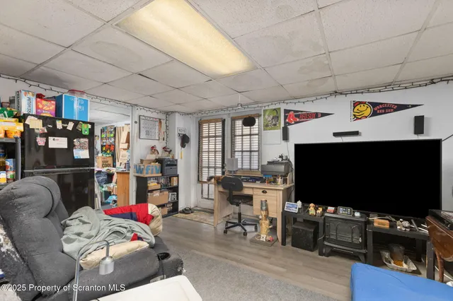 a living room with lots of furniture and a flat screen tv