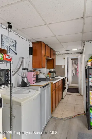 a kitchen that has a sink and a stove in it