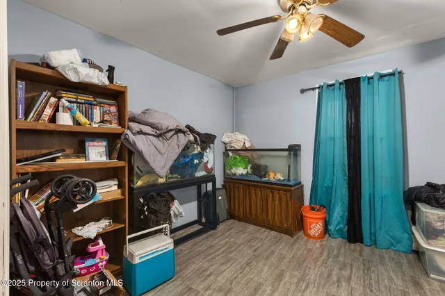 a bedroom with bunk bed and a window