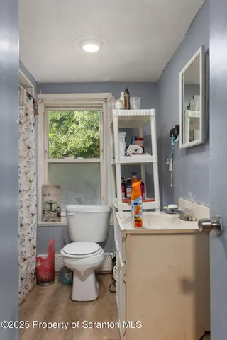 a living room with furniture a window and a sink