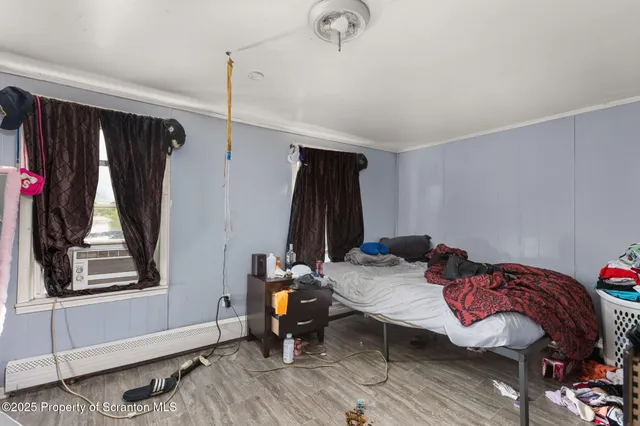 a bed room with a bed and a window