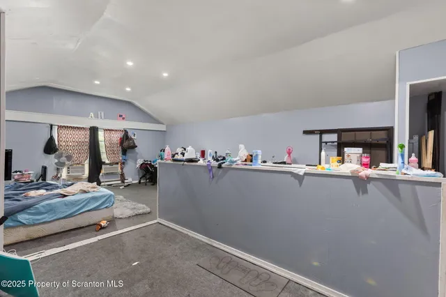 a living room with furniture and a table