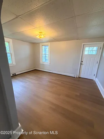 a view of an empty room and window