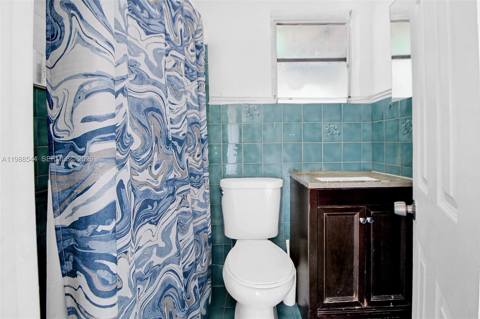 2900 Northwest 95th Street Miami, FL 33147 - Photo 11 of 48 a bathroom with a toilet and a sink