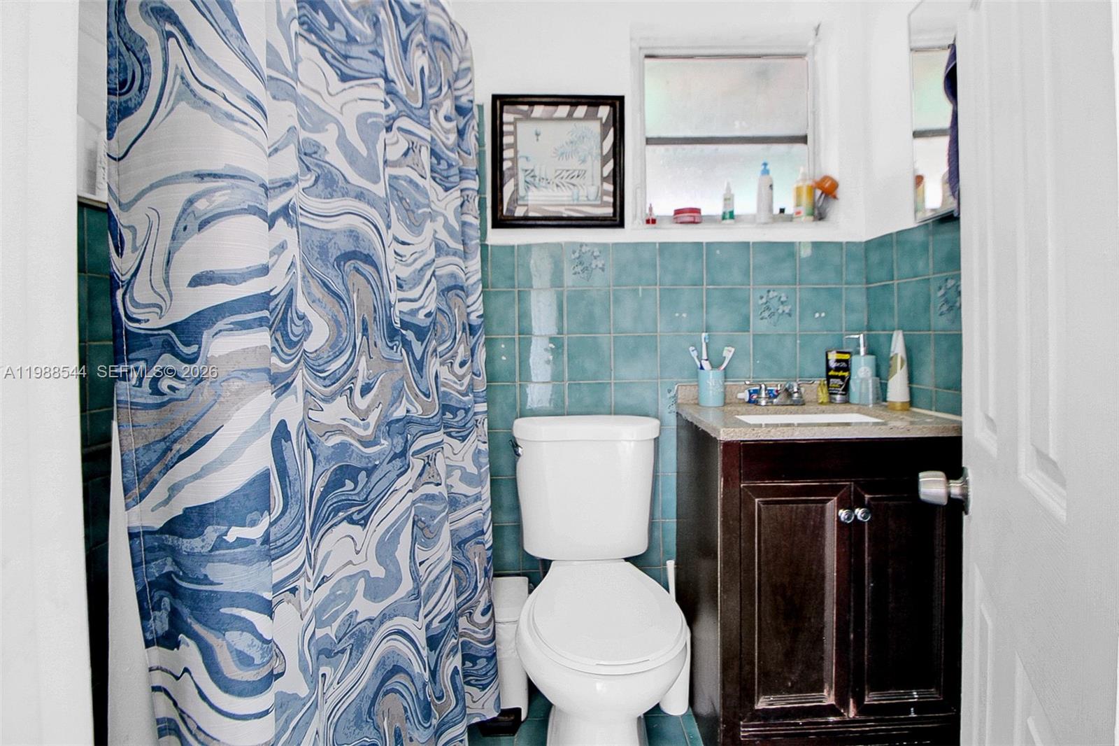 2900 Northwest 95th Street Miami, FL 33147 - Photo 12 of 48 a bathroom with a toilet and a sink