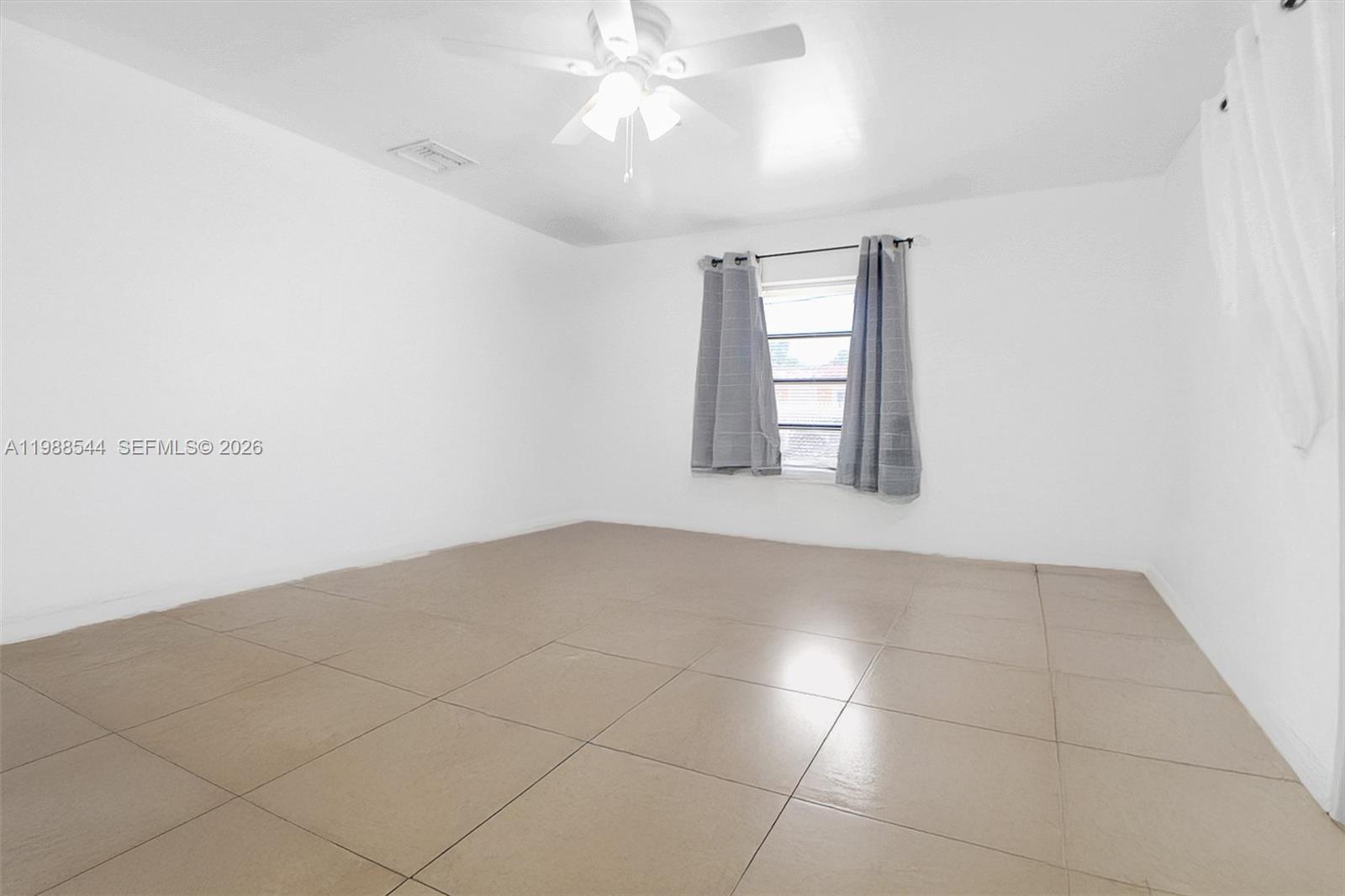 2900 Northwest 95th Street Miami, FL 33147 - Photo 13 of 48 a view of an empty room with a window