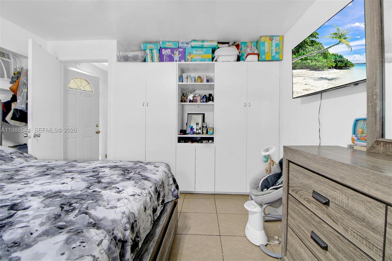 2900 Northwest 95th Street Miami, FL 33147 - Photo 16 of 48 a bedroom with a bed and a window