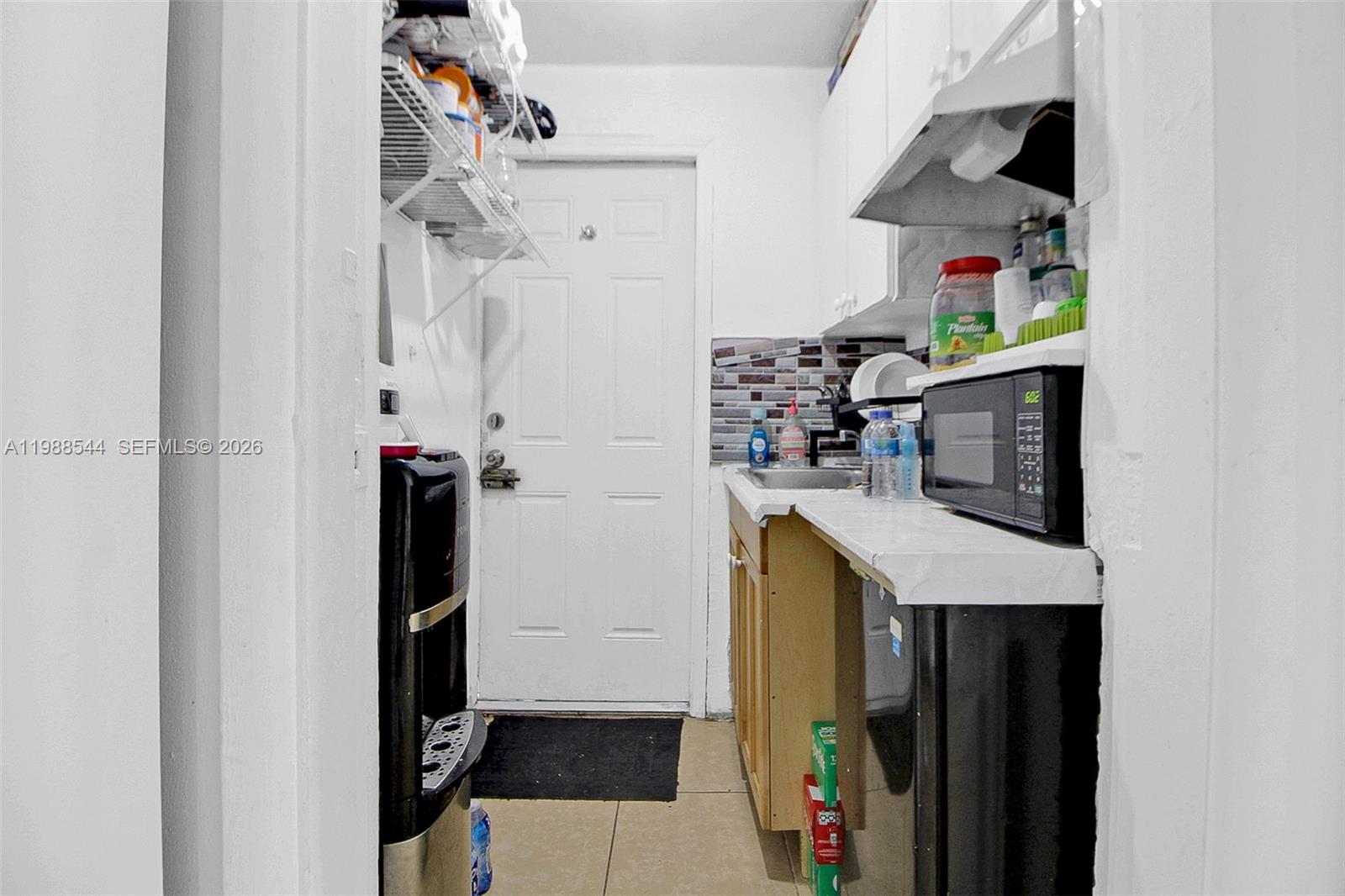 2900 Northwest 95th Street Miami, FL 33147 - Photo 19 of 48 a utility room with dryer and washer
