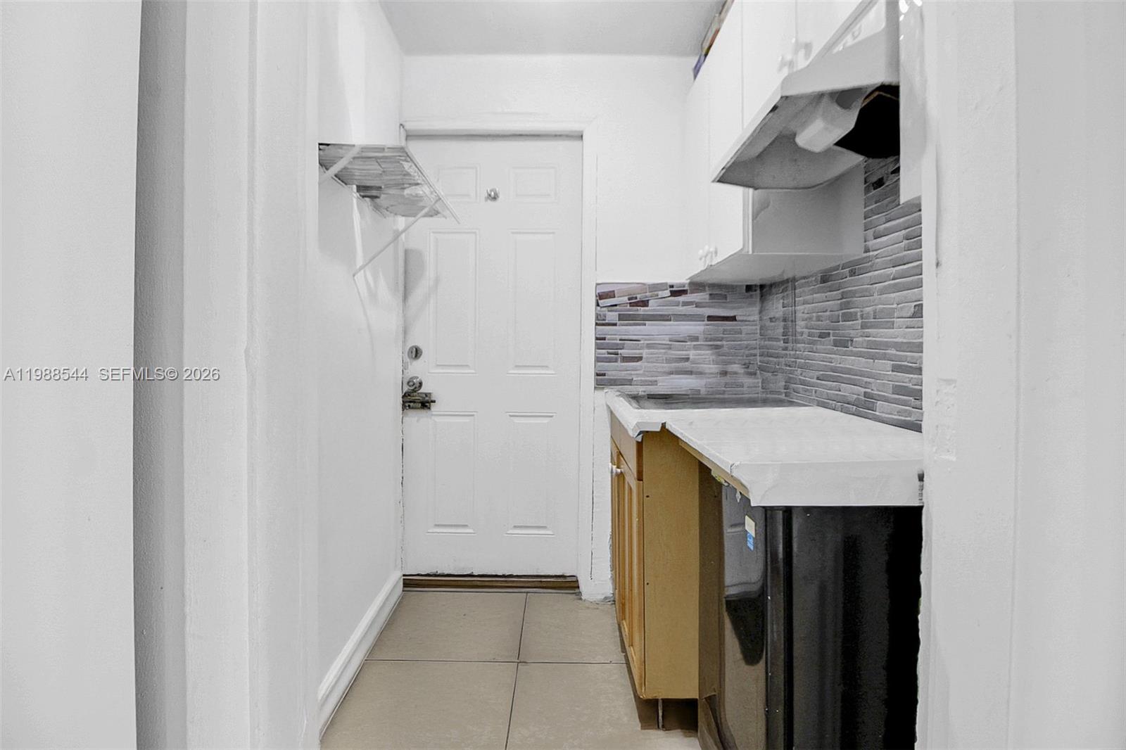 2900 Northwest 95th Street Miami, FL 33147 - Photo 20 of 48 a bathroom with a granite countertop shower and a sink