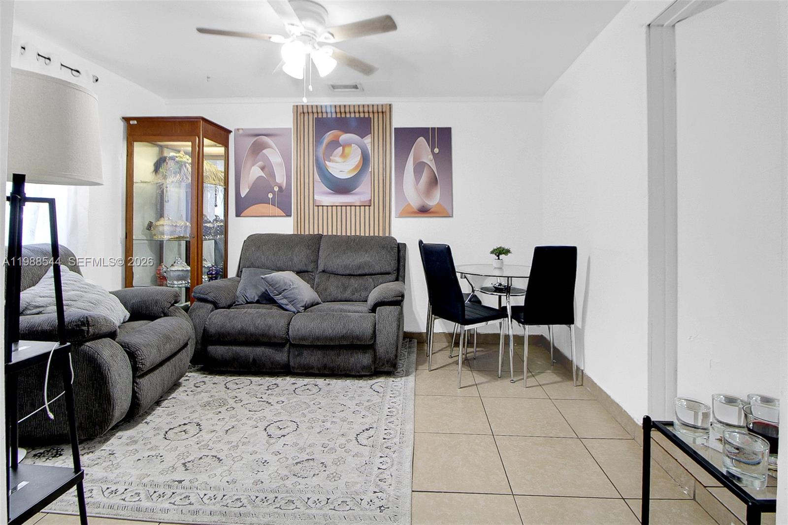 2900 Northwest 95th Street Miami, FL 33147 - Photo 22 of 48 a living room with furniture and window