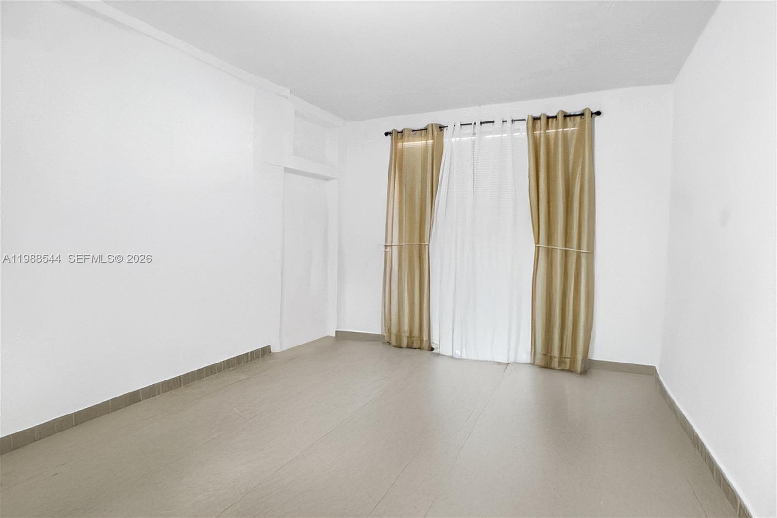 2900 Northwest 95th Street Miami, FL 33147 - Photo 24 of 48 a view of a small space with wooden floor and a window