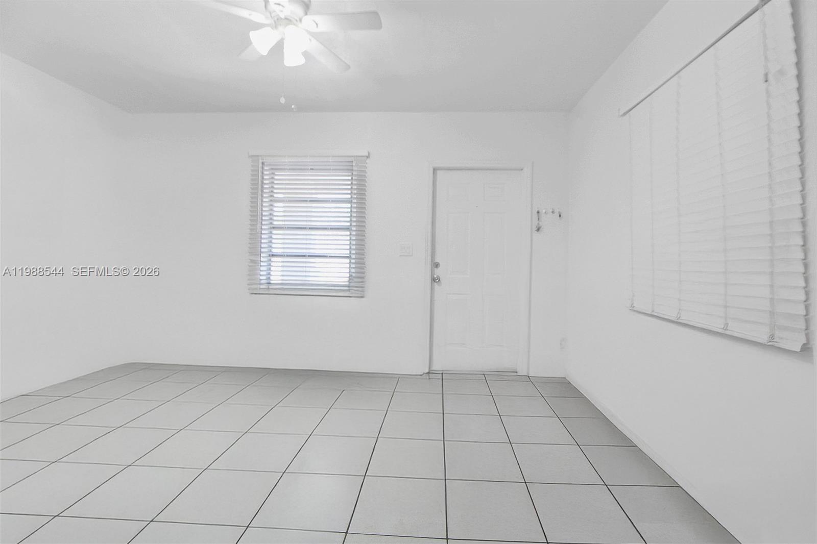 2900 Northwest 95th Street Miami, FL 33147 - Photo 31 of 48 wooden floor in an empty room with a window