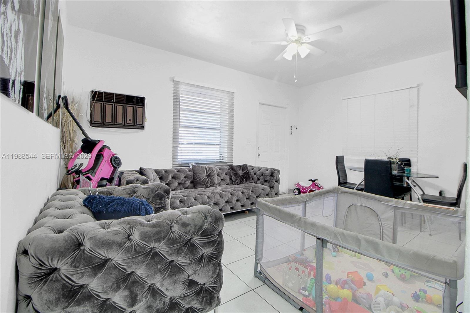 2900 Northwest 95th Street Miami, FL 33147 - Photo 43 of 48 a living room with furniture and a flat screen tv