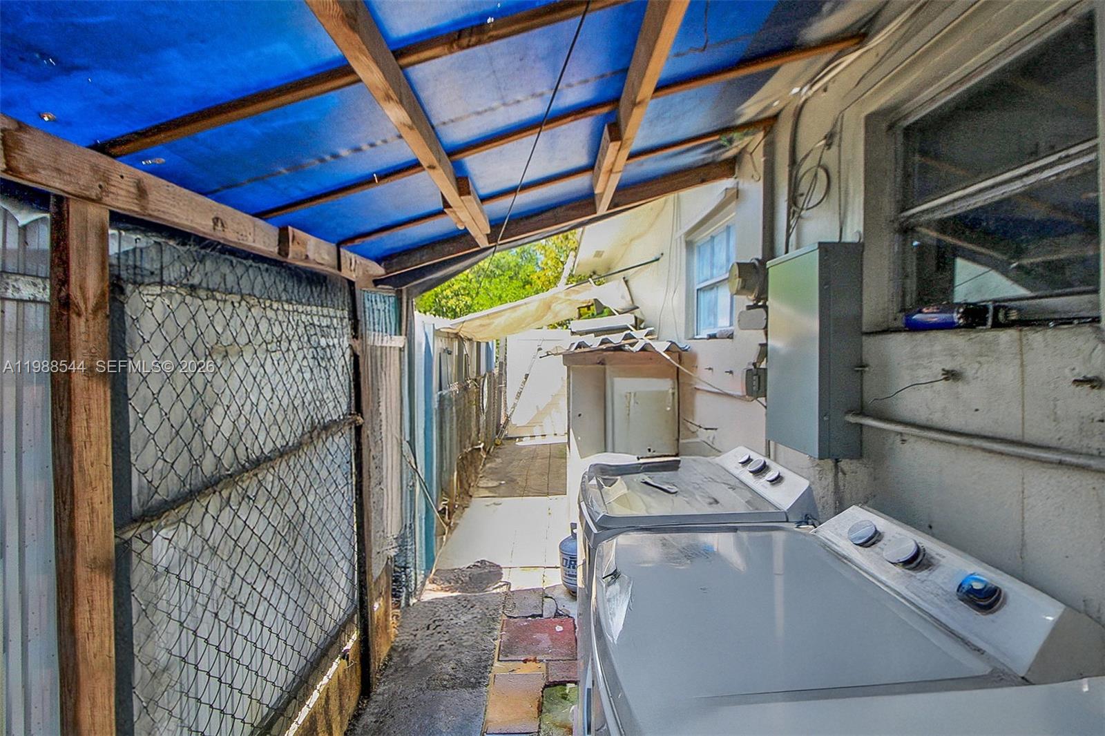 2900 Northwest 95th Street Miami, FL 33147 - Photo 45 of 48 a utility room with dryer and washer