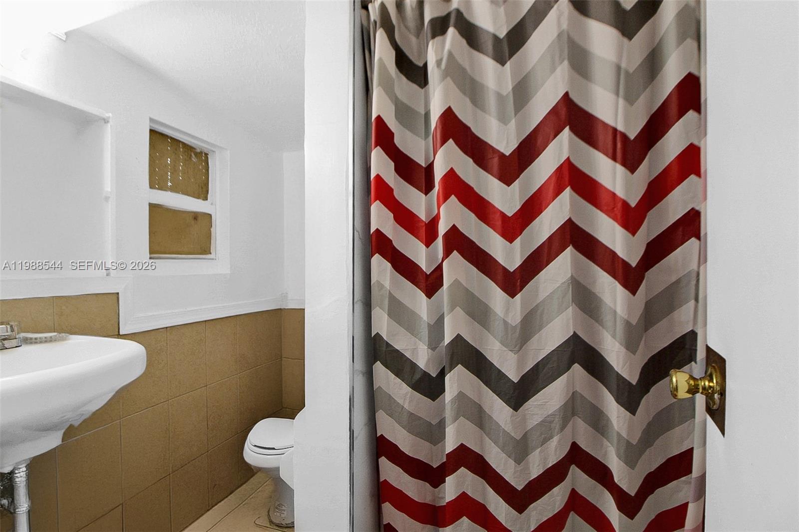 2900 Northwest 95th Street Miami, FL 33147 - Photo 9 of 48 a bathroom with a sink and toilet