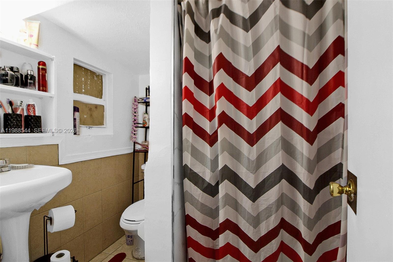 2900 Northwest 95th Street Miami, FL 33147 - Photo 10 of 48 a bathroom with a sink a mirror and a toilet