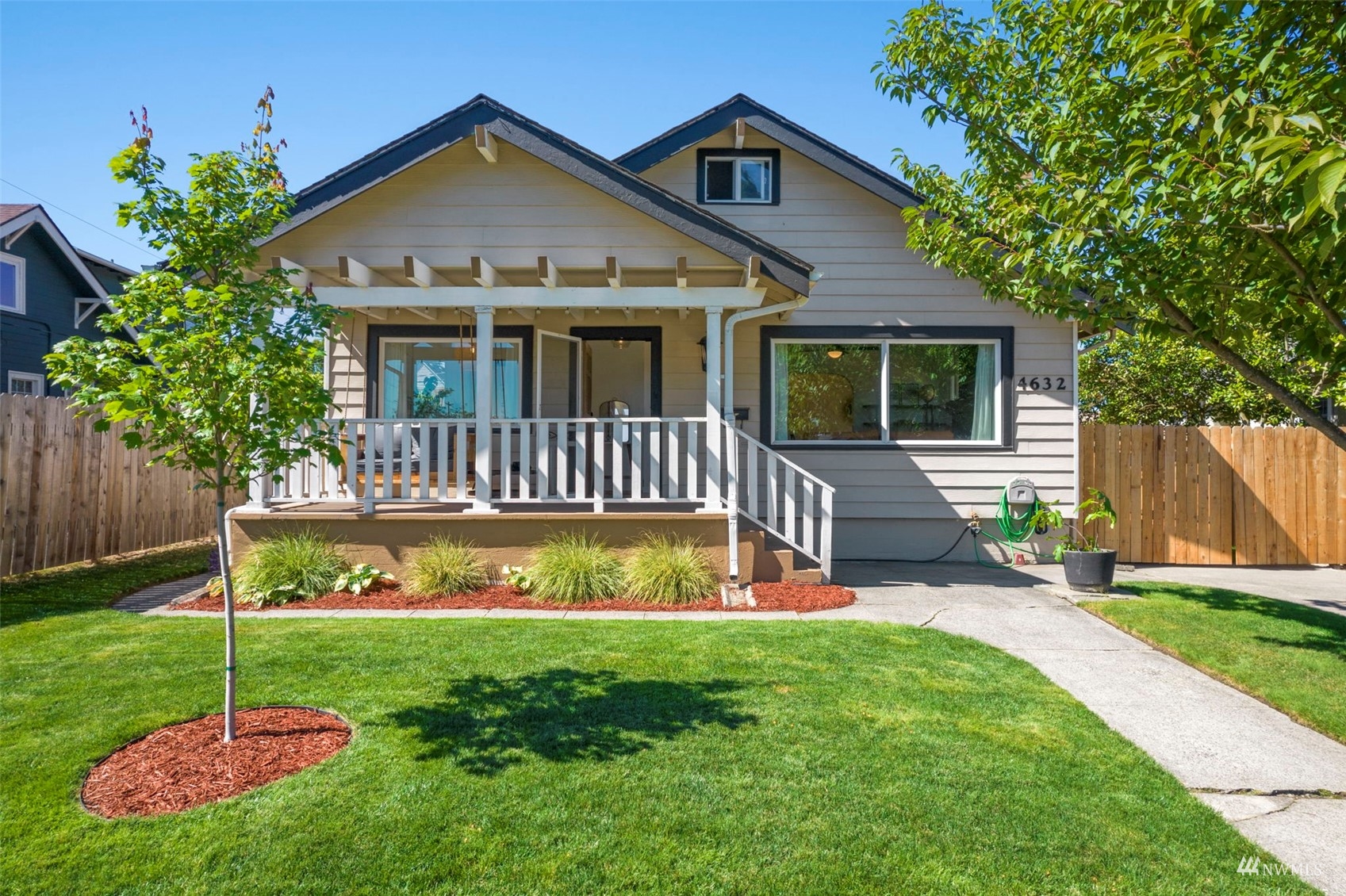 4632 Fawcett Avenue Tacoma, WA 98408 - Photo 1 of 35 a view of a house with a yard potted plants and a large tree