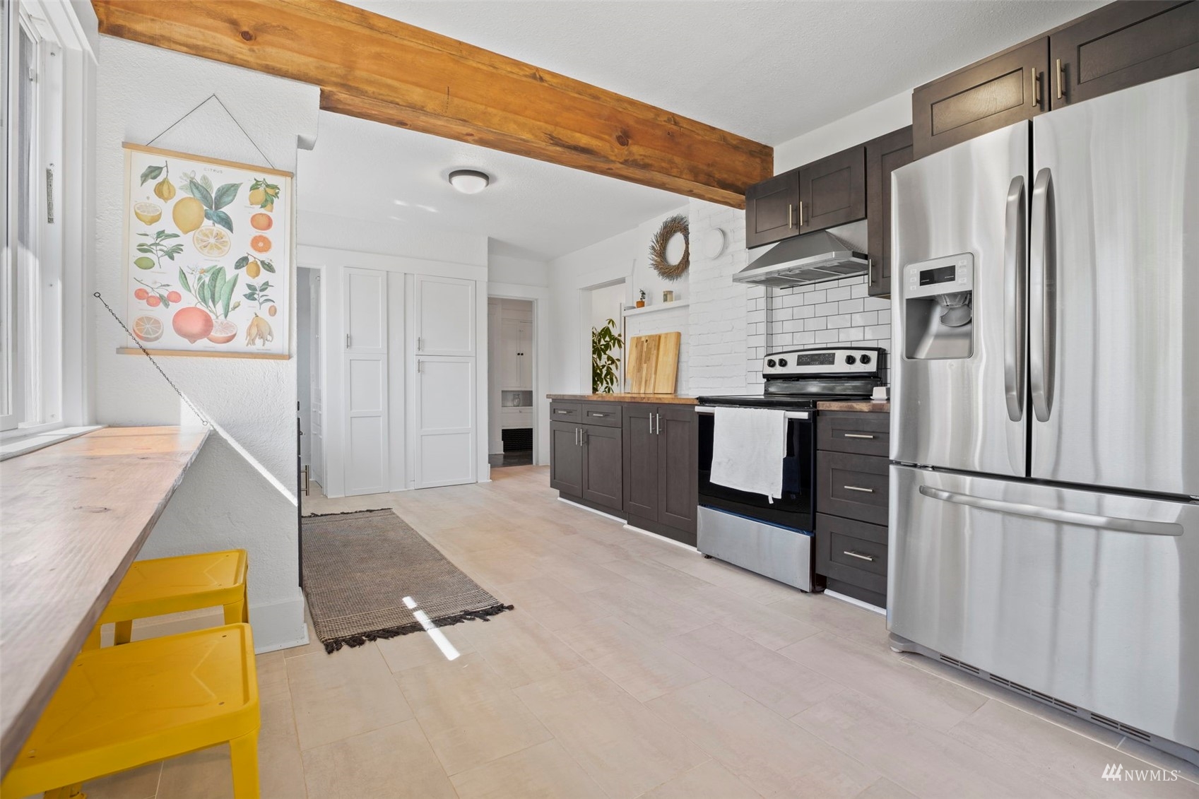 4632 Fawcett Avenue Tacoma, WA 98408 - Photo 14 of 35 a kitchen with stainless steel appliances granite countertop a refrigerator and a stove