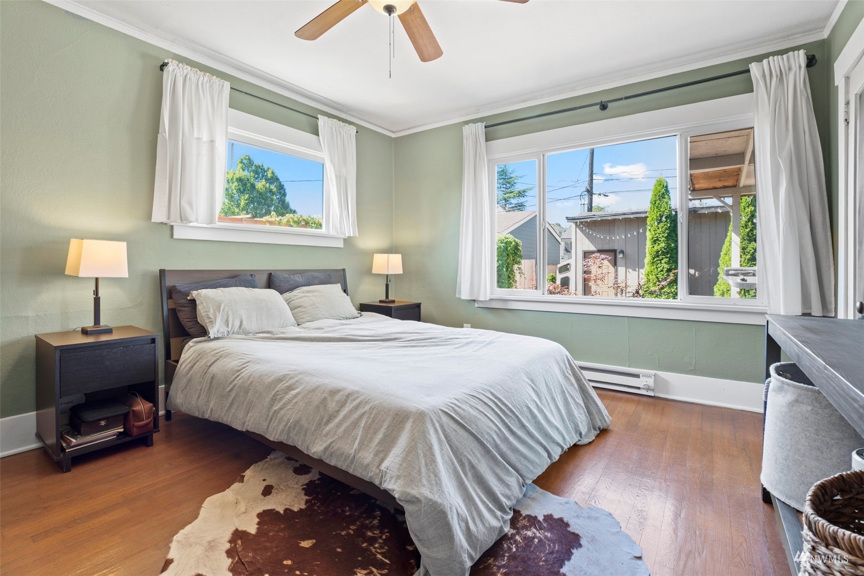 4632 Fawcett Avenue Tacoma, WA 98408 - Photo 21 of 35 a bedroom with a bed and a painting on the wall