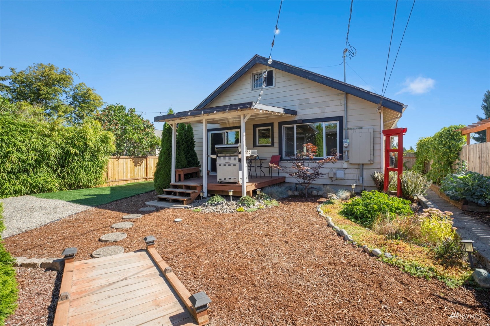 4632 Fawcett Avenue Tacoma, WA 98408 - Photo 28 of 35 a front view of a house with a yard and garage