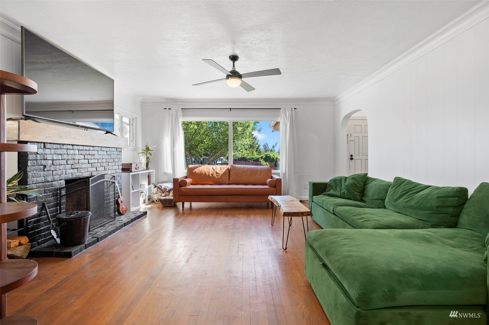 4632 Fawcett Avenue Tacoma, WA 98408 - Photo 6 of 35 a living room with furniture and a fireplace