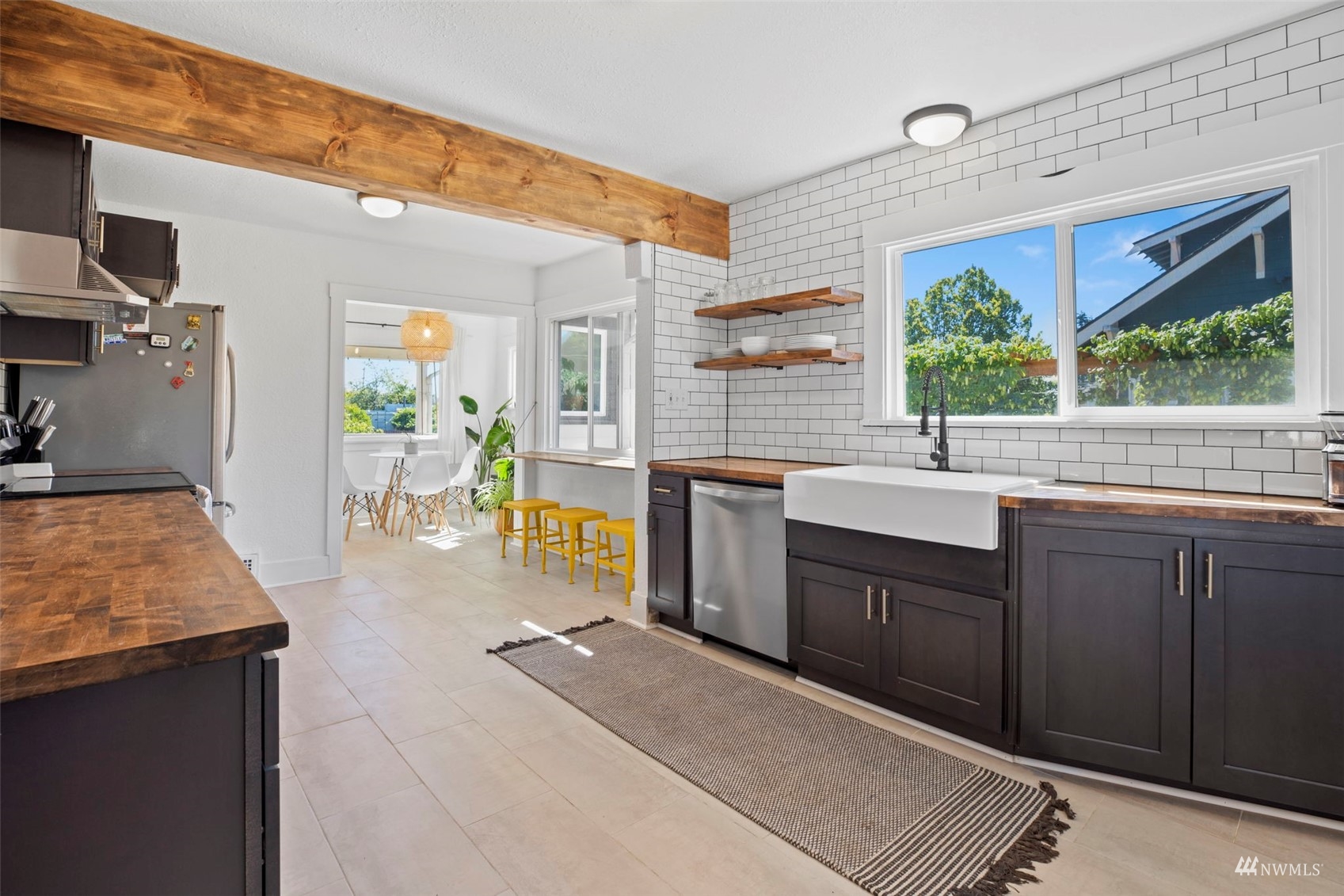 4632 Fawcett Avenue Tacoma, WA 98408 - Photo 10 of 35 a kitchen with stainless steel appliances granite countertop a stove a sink and a microwave