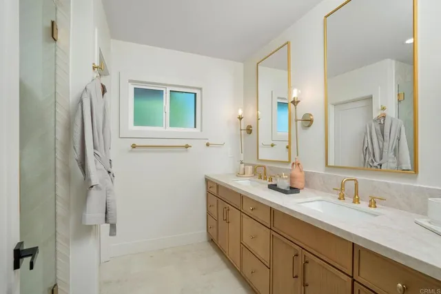 a bathroom with a double vanity sink mirror and double