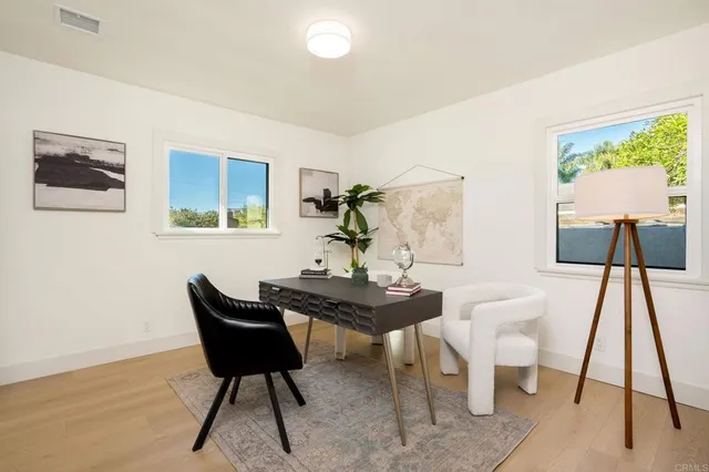 a dining room with furniture and window
