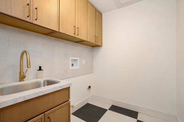 a kitchen with a sink and cabinets