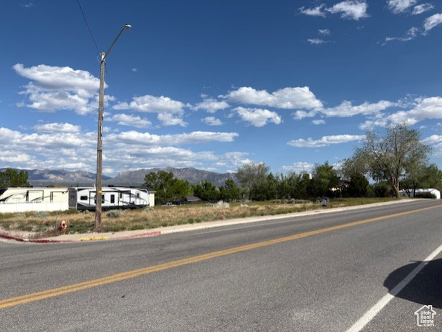 480 North Main Street, Unit 7 8 Milford, UT 84751 - Photo 7 of 11 View of asphalt street with a mountain view, street lights, and curbs