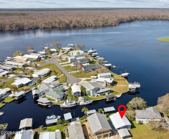 a picture of a table and chairs in wooden floor