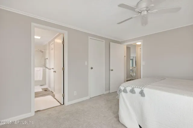 a bedroom with a bed and a table