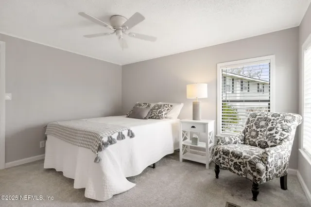 a bathroom with a granite countertop sink toilet and a mirror