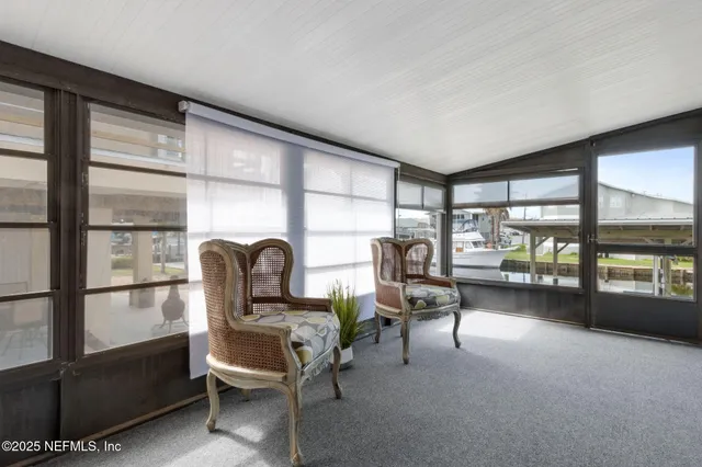 a porch with a table and chairs