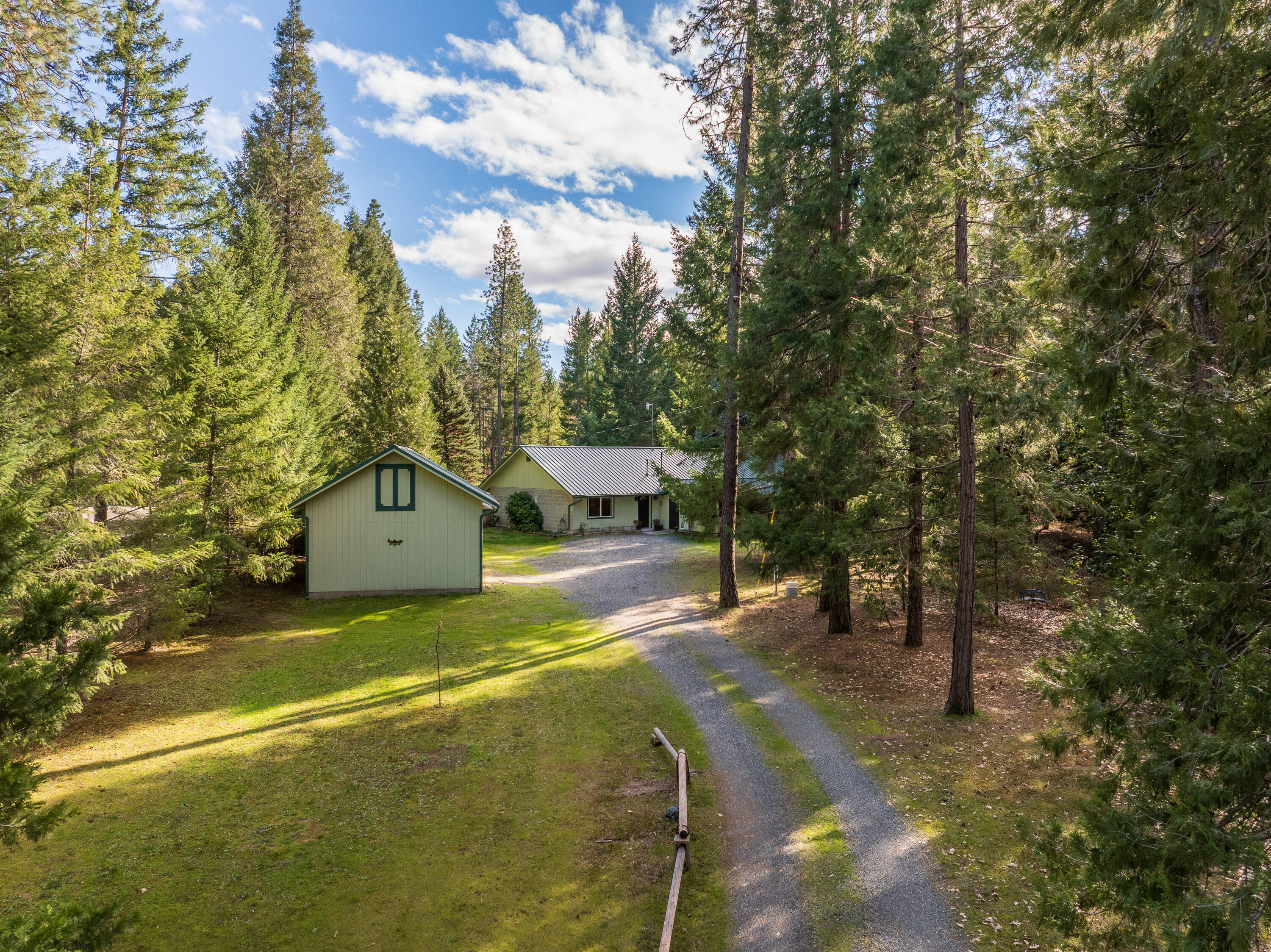 244 Riessen Road Grants Pass, OR 97526 - Photo 1 of 52 a view of a house with a yard