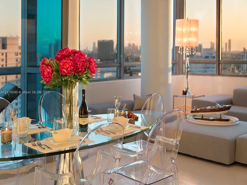 101 20th Street, Unit 2002 Miami Beach, FL 33139 - Photo 1 of 16 a outdoor dining space with furniture and a potted plant