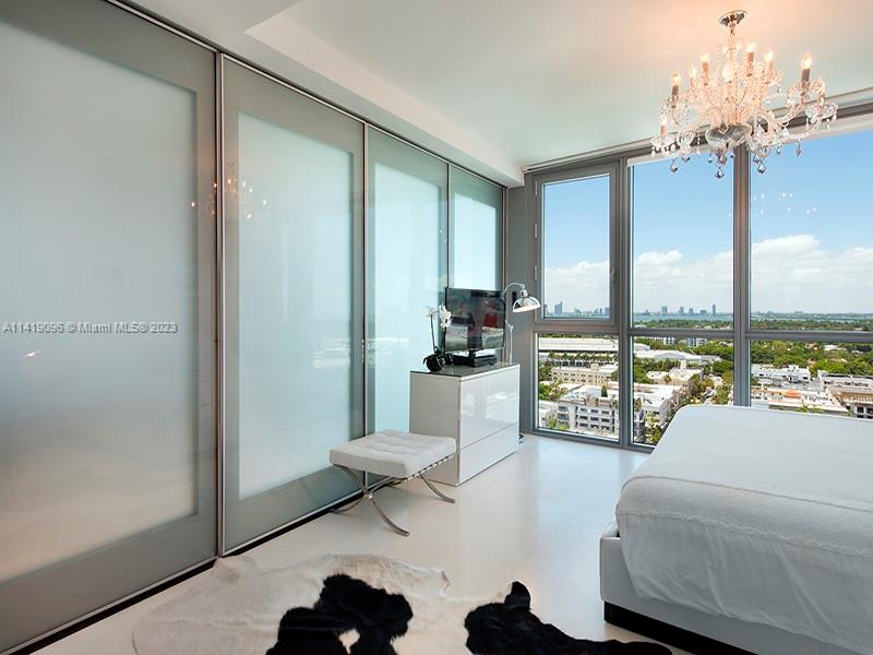 101 20th Street, Unit 2002 Miami Beach, FL 33139 - Photo 9 of 16 a living room with furniture and a large window