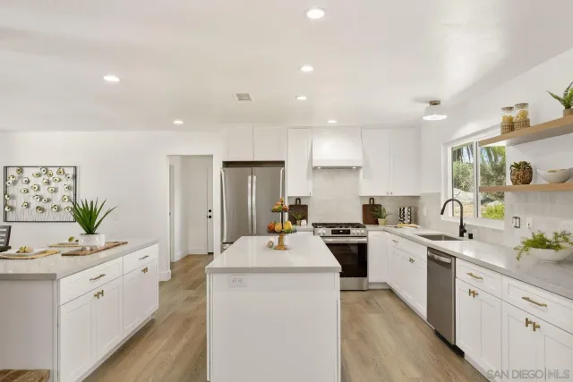 a view of a dining room with furniture and window