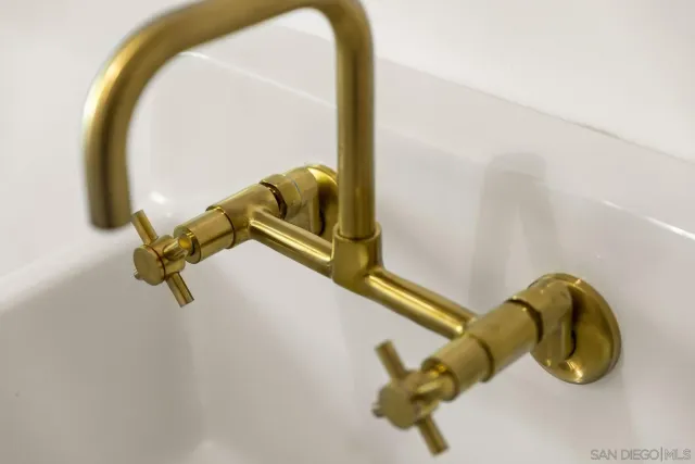 a bedroom with a bed and a lamp on table