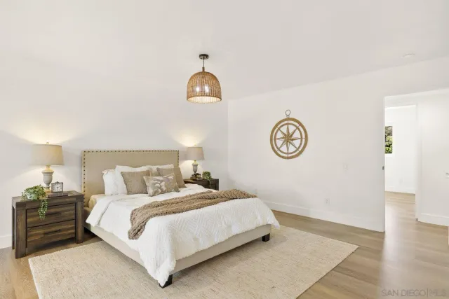 a living room with furniture and large window