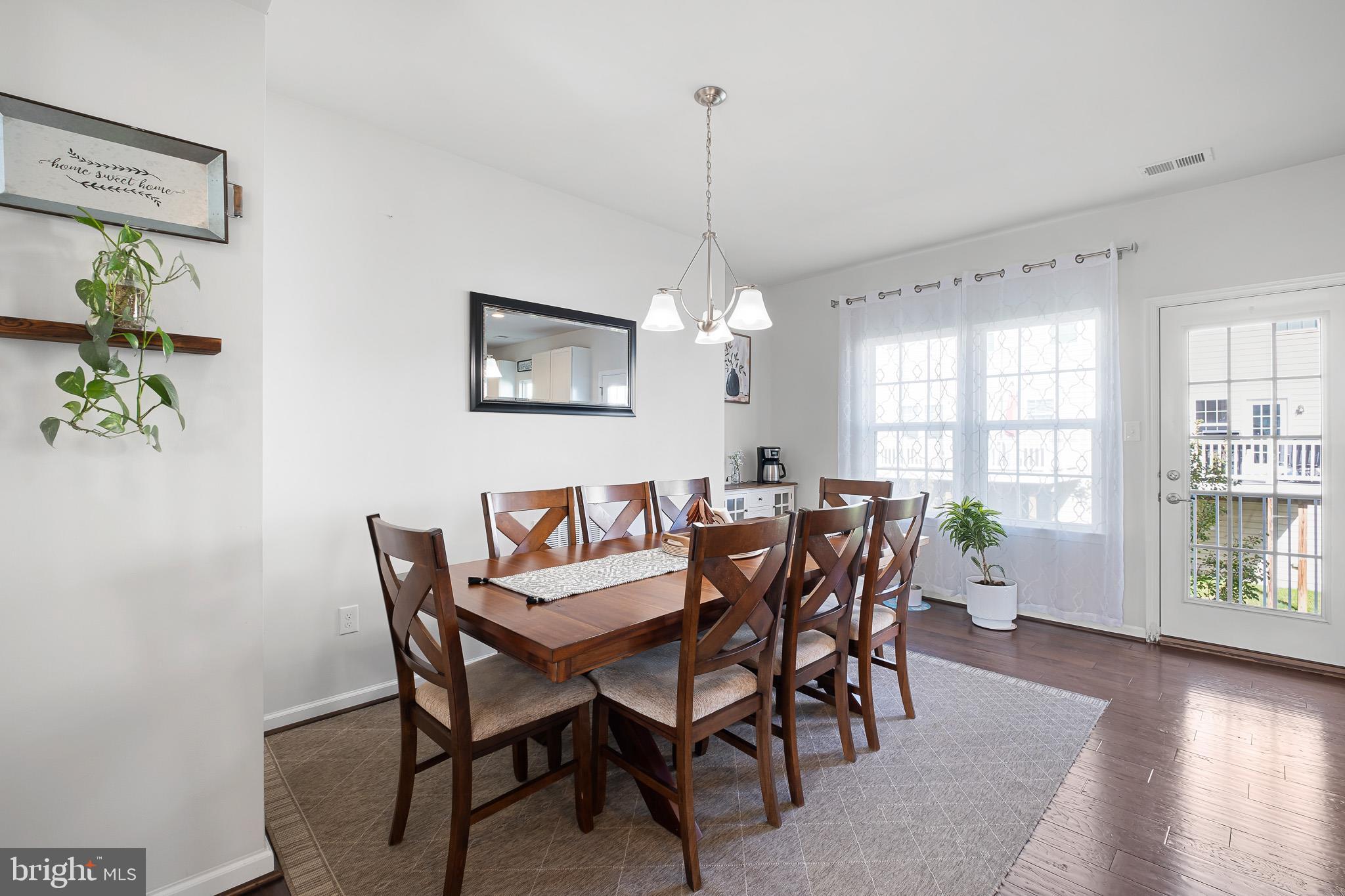 449 Smee Road Middletown, DE 19709 - Photo 15 of 31 a view of a dining room with furniture window and wooden floor