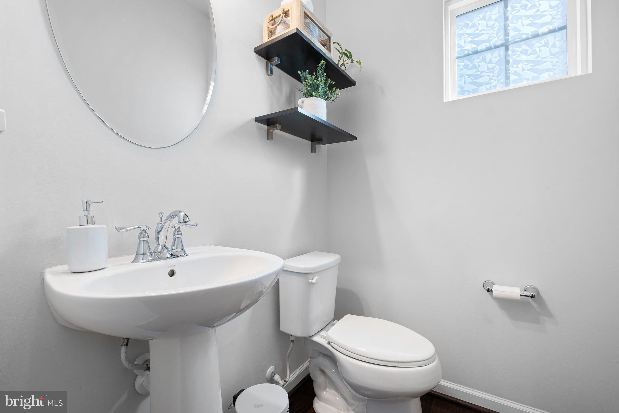 449 Smee Road Middletown, DE 19709 - Photo 16 of 31 a bathroom with a toilet sink and mirror