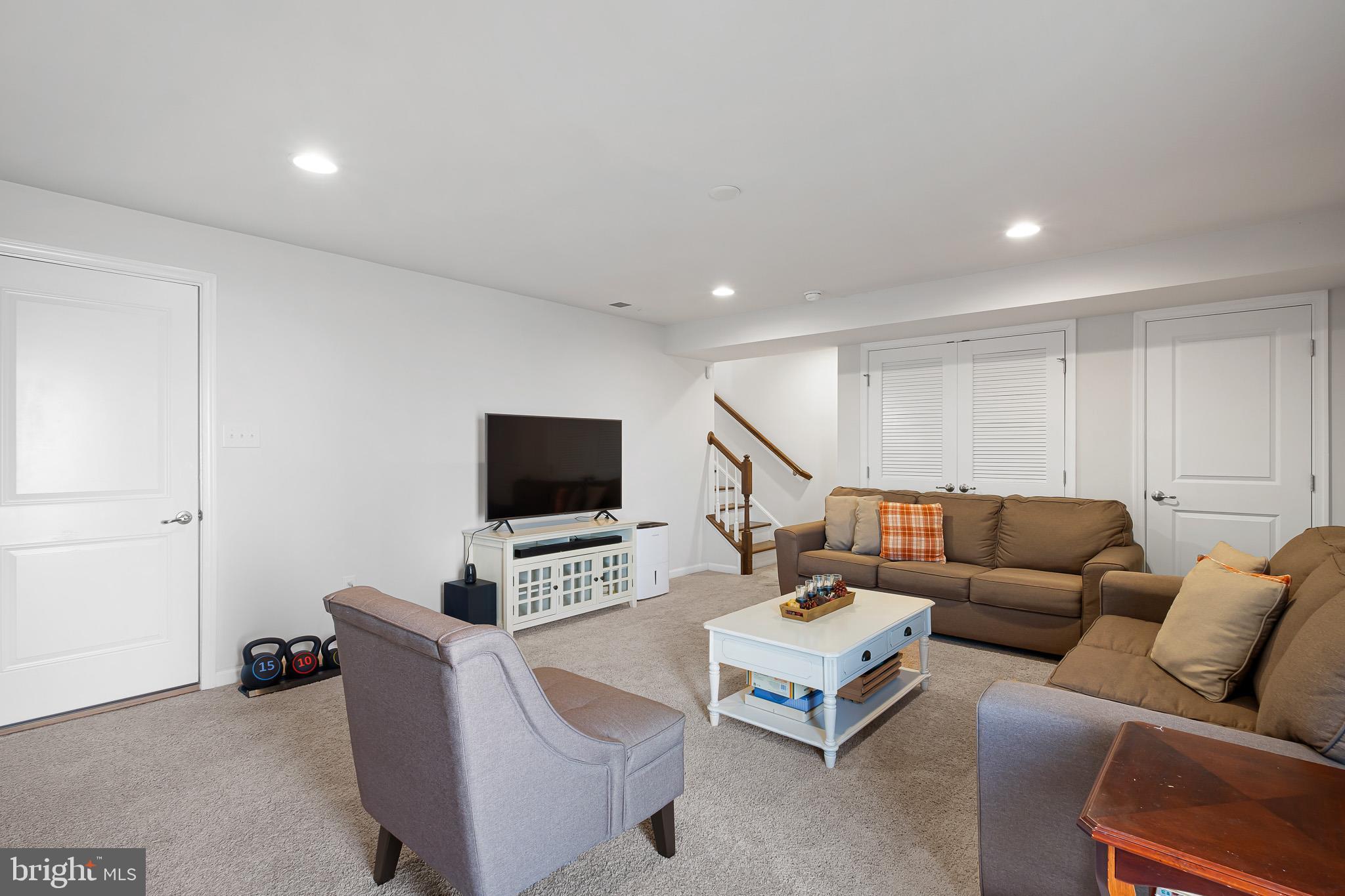 449 Smee Road Middletown, DE 19709 - Photo 17 of 31 a living room with furniture and a flat screen tv