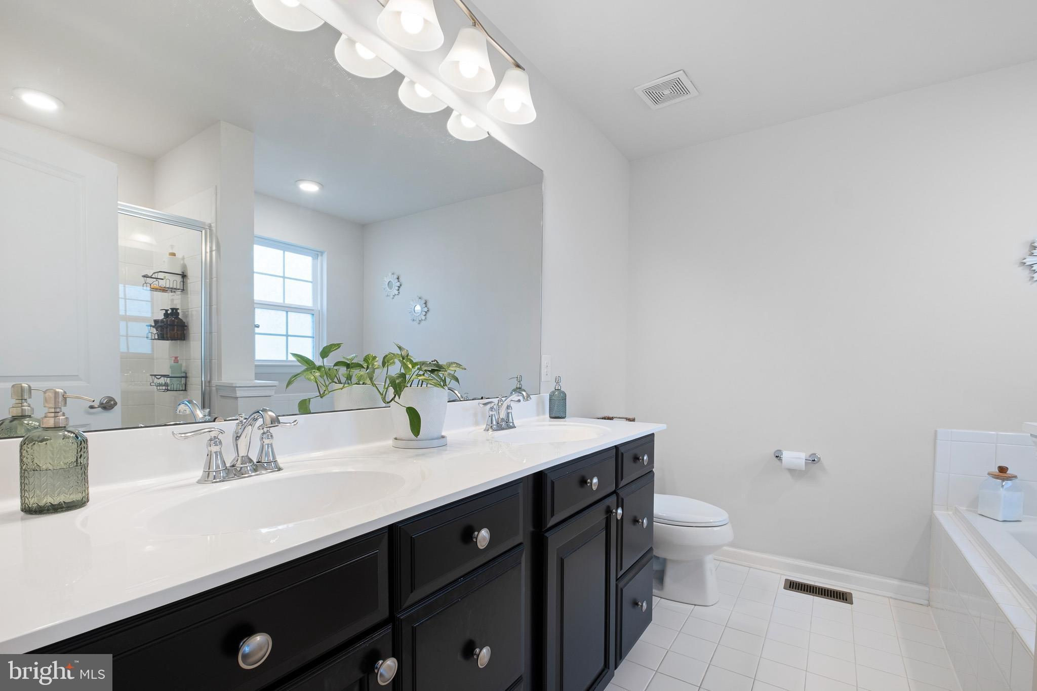 449 Smee Road Middletown, DE 19709 - Photo 21 of 31 a bathroom with a double vanity sink mirror and toilet