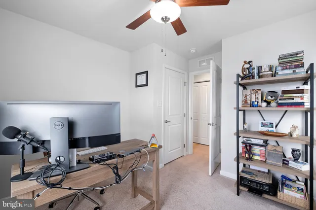 a view of a workspace with furniture