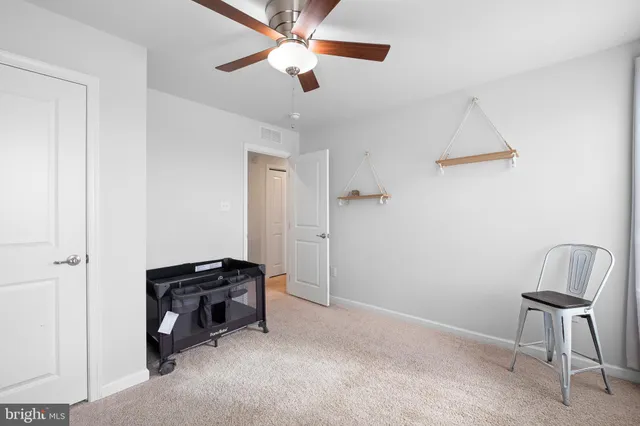 a view of workspace and bedroom with furniture